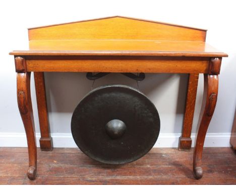 A 19th century oak hall or serving table, of rectangular form with raised back, cabriole front supports carved with cartouche