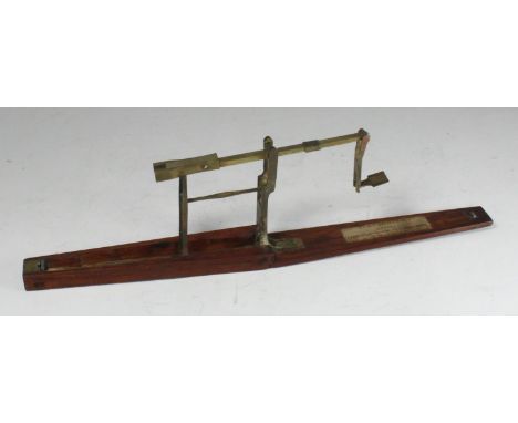 A set of 18th century mahogany and brass sovereign scales by 'T. Houghton', 14.5cm long 
