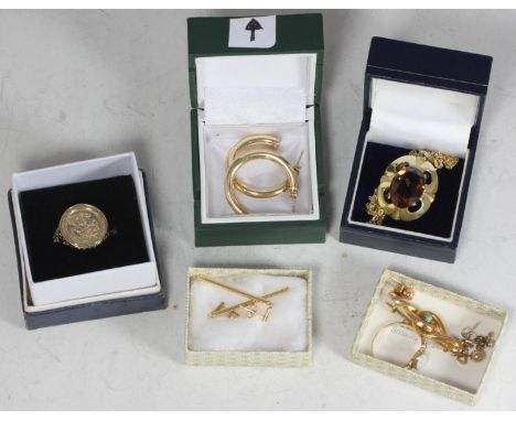 A small collection of assorted 9ct gold jewellery items comprising a ring, various earrings, a brooch and a yellow metal broo