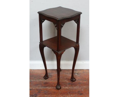 A stained wood Oriental two-tier square occasional table / jardiniere stand with shaped and carved top, carved spandrels, rai