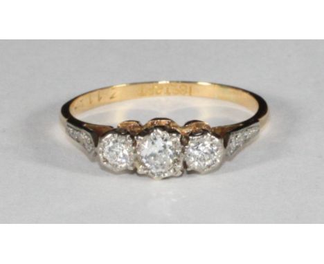An 18ct gold and platinum three-stone diamond ring, estimated 0.35pts, 2.16g 