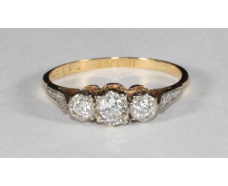 An 18ct gold and platinum three-stone diamond ring, estimated 0.35pts, 2.16g 