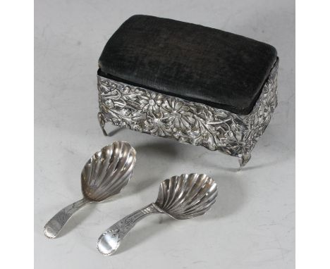 Two George III silver 'Old English' pattern caddy spoons with shell bowls and bright-cut decoration, together with a George V