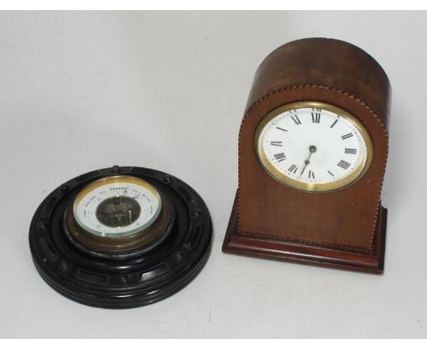 An Edwardian mahogany mantel clock, with white enamel dial, Roman numerals, arched case, 20cm high, together with an aneroid 