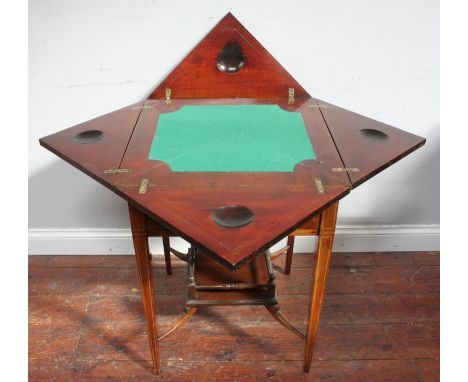 An Edwardian inlaid mahogany envelope folding card table, the top revealing a green playing baize, above a single frieze draw
