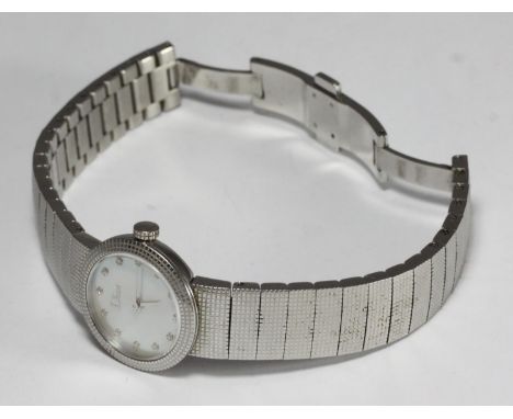 A ladies stainless steel Christian Dior wristwatch, the pearlescent dial with white stone dots denoting hours, on stainless s