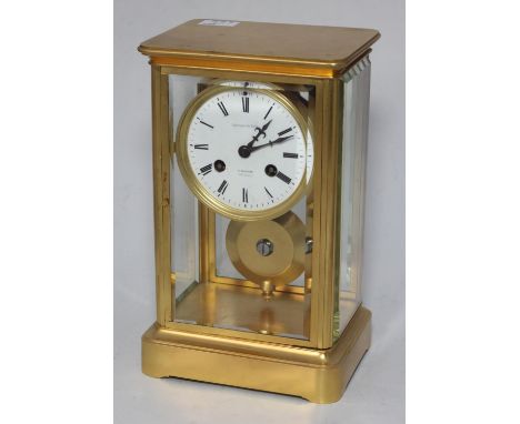 French gilt brass mantel clock, white enamel dial with Roman numerals, with four bevelled glass panels, by G. Blackie, with k