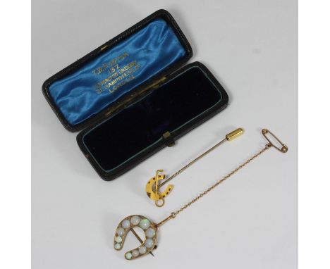 An Early 20th century unmarked yellow-metal opal and diamond brooch, of horseshoe design set with nine graduated opals and tw