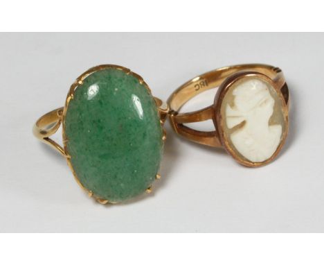 An 18ct gold ring set with an oval carved female shell cameo, 3.64g, and a 22ct gold ring set with an oval cabochon cut and p