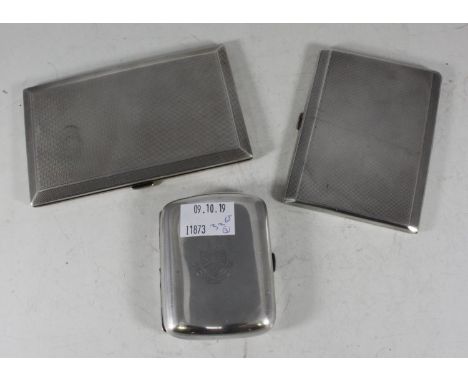 Two silver pocket cigarette cases with engine-turned decoration, Birmingham, 1920 (larger example), and London, 1935, and a V