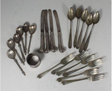 A silver napkin ring together with four silver-handled knives and some plated flatwares 