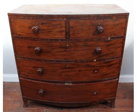 A 19th century bow-front mahogany chest of two short and three long graduated drawers, turned pulls (two missing), splayed br