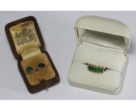 A pair of 9ct gold earrings each set with a faceted oval emerald coloured stone, together with a yellow metal (tests as 9ct g