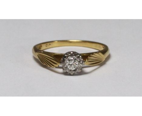 An 18ct gold solitaire diamond ring, illusion-setting supported by stylised wings, approximately 0.10pts, 2.8g 