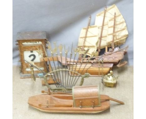 Two hardwood model sampans, incense burner, brass display of Oriental pole arms, perpetual calendar etc