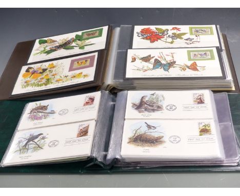 Eight thematic albums of first day covers relating to Butterflies, Cats, Transportation, Flowers, World of Sports, The Royal 