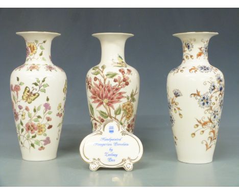 Three Zsolnay Pecs vases and an advertising plaque, tallest 27cm&nbsp;
