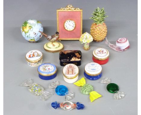 A collection of enamel boxes and novelty items including Kitney and Co clock, enamel globe, pineapple, boxes including Crumml