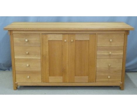 Contemporary Arts and Crafts style light oak sideboard with eight drawers flanking cupboards, W160 x D55 x H85cm