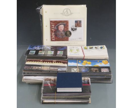 A quantity of GB presentation packs, first day covers and coin / stamp covers