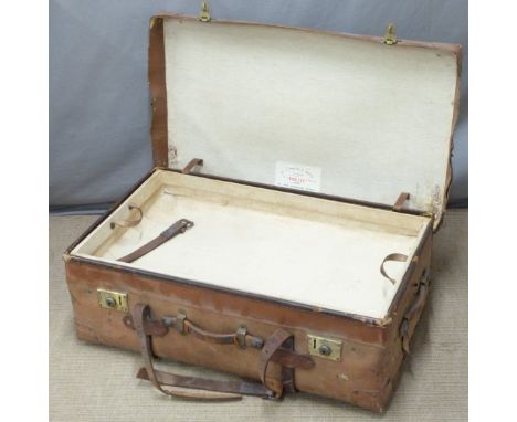 A vintage leather steamer trunk with lift out tray by H J Cave and Son, sole makers of the "Osilite" Trunk, W82 x D49 x H28cm