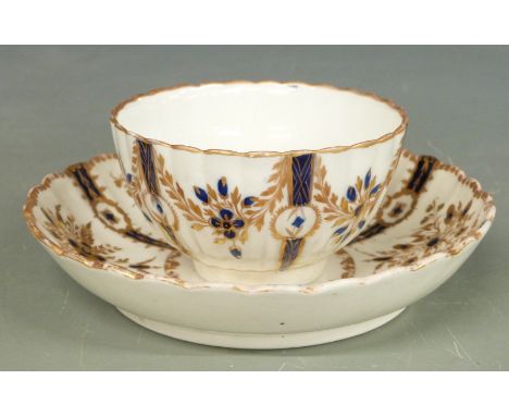Caughley tea bowl and saucer with royal blue and gilt decoration