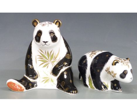 Two Royal Crown Derby paperweights, Giant Panda and Baby Panda Walking, both boxed, tallest 13.5cm