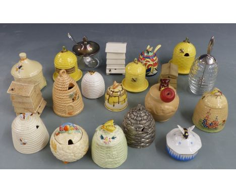 Twenty honey pots including Crown Devon, Charmouth Pottery, several Goebel, Clarice Cliff, plated examples and an Italian rib