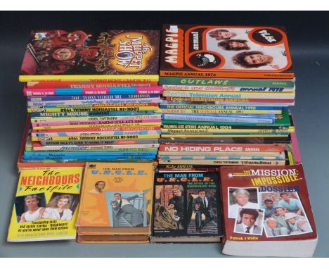 Fifty-five TV related annuals and books including Man From UNCLE, Magic Roundabout, Mission Impossible, mainly 1960's and 197