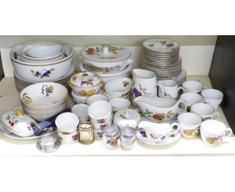 A collection of Royal Worcester Evesham pattern dinner, tea and oven ware including covered tureens, fruit bowl, plates, rame