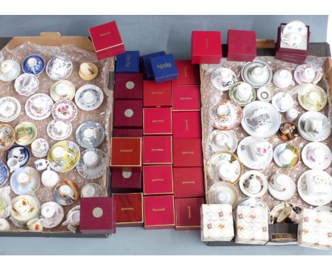 A large collection of miniature/collectable cups and saucers including Royal Albert (multiple patterns including Old Country 