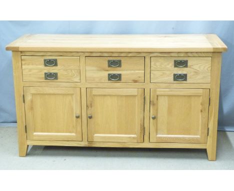 Contemporary light oak sideboard with three drawers and three cupboards, W160 x D57 x H90cm