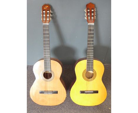 Two acoustic guitars fitted with nylon strings, one unlabelled in high gloss lacquered finish, the other a Spanish Admira Mal