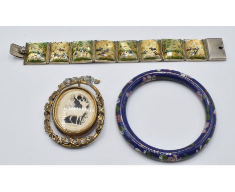 A white metal bracelet set with painted mother of pearl panels, a cloisonné bangle and a Victorian pinchbeck brooch