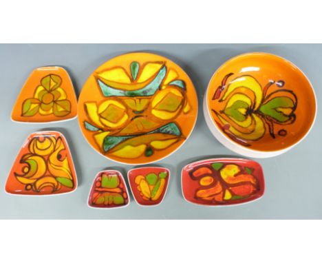 A collection of retro Poole Pottery Delphis ware including a charger and pedestal bowl, largest diameter 27cm
