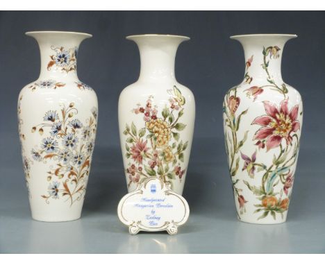 Three large Zsolnay Pecs vases and an advertising plaque, tallest 34cm&nbsp;