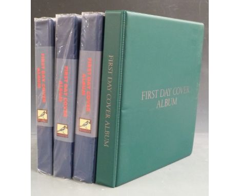 Four albums of first day covers