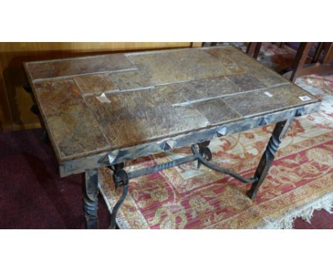 A French low table, with flagstone top over distressed meal base with flowers des lys decoration, W:45cm L:78cm H:44cm