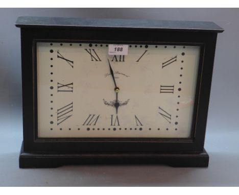 A contemporary ebonised mantel clock