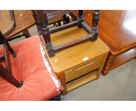 A light elm effect bedside table 