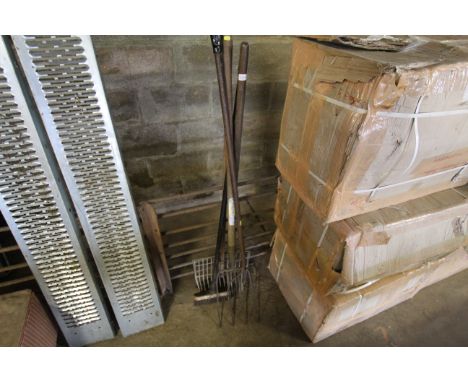 A quantity of long handled tools to include fork, brush etc.