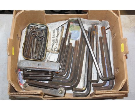 A crate containing various allen key tools