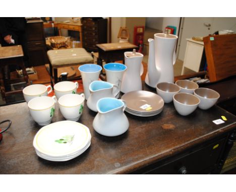 A Poole Pottery part coffee set, two Poole Pottery jugs, a pair of Burslem posy vases and four teacups and saucers
