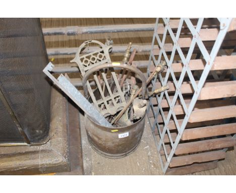 A brass coal bucket and contents of fireside tools to include tongs, shovel etc.