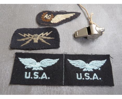 R.A.F. INTEREST, consisting of a WWI air crew whistle, an A.G. cloth wing wireless operator patch and an uncut pair of WWII U
