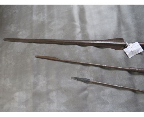 A MASAI LION HUNTING SPEAR, with long iron tips and central wooden grip, along with two smaller African spears (3)