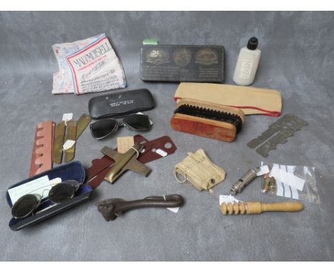 A BOX OF MILITARY INTERST COLLECTABLES, to include a WWI era Colonies chocolate tin, Bully beef tin opener, button sticks etc