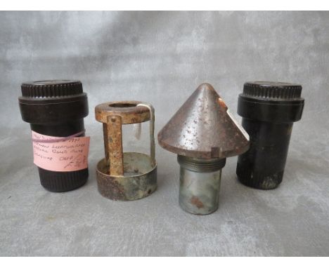 A 1 TON BOMB FUSE (INERT), two German Luftwaffe bakelite bomb fuse cases and a German Krupp fuse guard