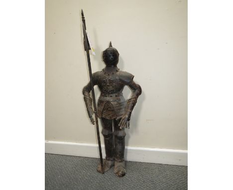 A DECORATIVE METAL FIGURE OF A STANDING KNIGHT IN ARMOUR HOLDING A POLE ARM, H 89 cm