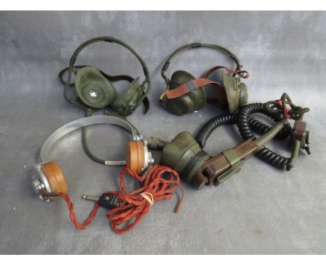 TWO PAIRS OF WWII RADIO HEADPHONES, marked 5965-99-100, the first dated 1939, the second 1940, the later also fitted micropho